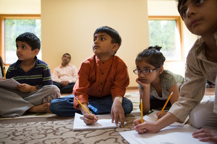 Praneel Ankalkoti, 8, from left, Koustub Grama, 6, Gargi Basavapatna, 6, and Akhil Samrat, 8, attend a children's Sanskrit language class taught by Sowmya Joisa, not pictured, in Newcastle, on Saturday, May 10, 2014.  (Photograph by MARCUS YAM/The Seattle Times)