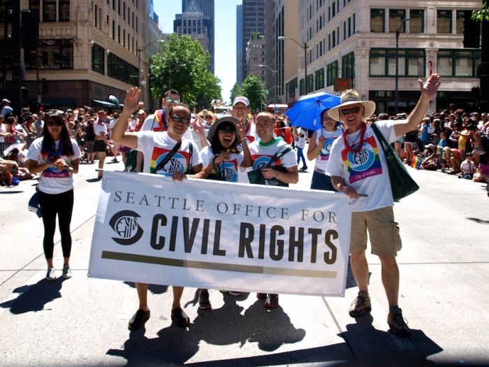 The Seattle Office of Civil Rights marches in the 2013 Pride Parade, which drew over 50,000 people. What began as a radical march in 1974 has become a mainstream, citywide event. (Photo courtesy Seattle Pride)