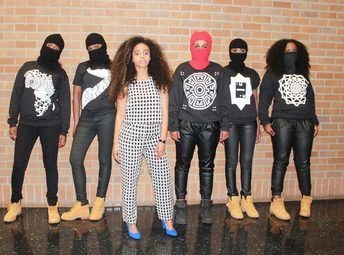 Hamdi Lilah, center, with models wearing some of her designs. Her "Free Somalia" design is second from left. (Photo courtesy of Hamdi Lilah)