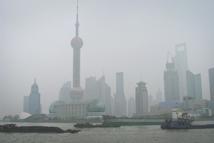 Shanghai, China shrouded in smog. Overall China emits 6.2 metric tons of CO2 per year. (Photo from Wikipedia)