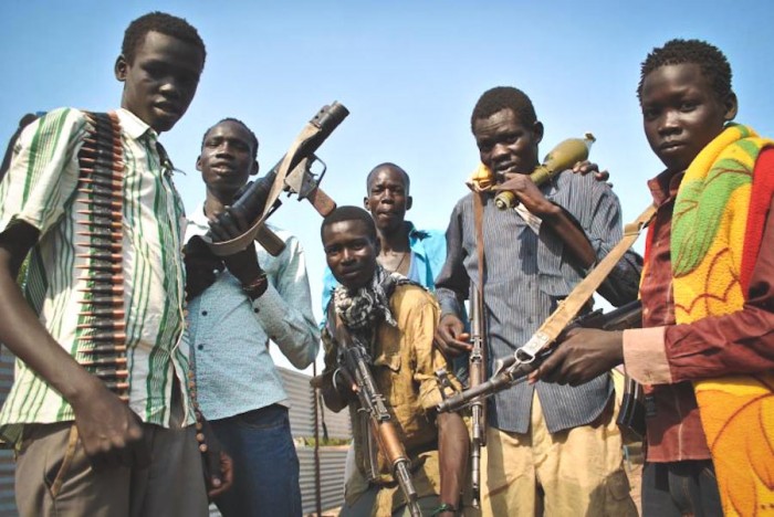 Young Sudanese men armed by the Nuer White Army, an ethnic militia fighting on behalf of former Vice President Riek Machar. (Photo by Jacey Fortin / International Business Times)