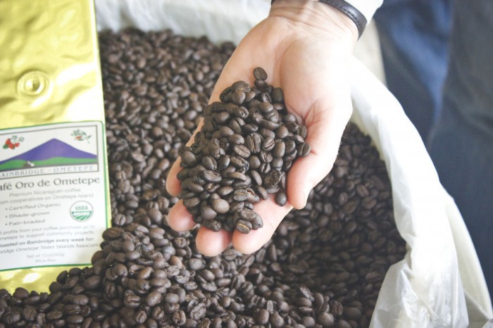 Lee Robinson shows off freshly roasted beans from the Ometepe Island in Nicaragua. (Photo by Hannah Myrick)