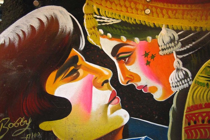 A rickshaw painted by Bobby Solanki depicts a classic Bollywood scene featuring Amitabh Buchchan and Rekha. (Photo from Flickr by Meena Kadri)