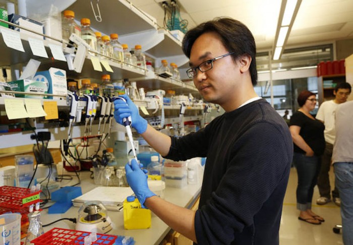 David La at the UW’s Baker Laboratory is part of a team working on potential Ebola treatments, but they’re also crowdsourcing ideas over the Internet relating to a cure. (Photo by Mark Harrison / The Seattle Times)
