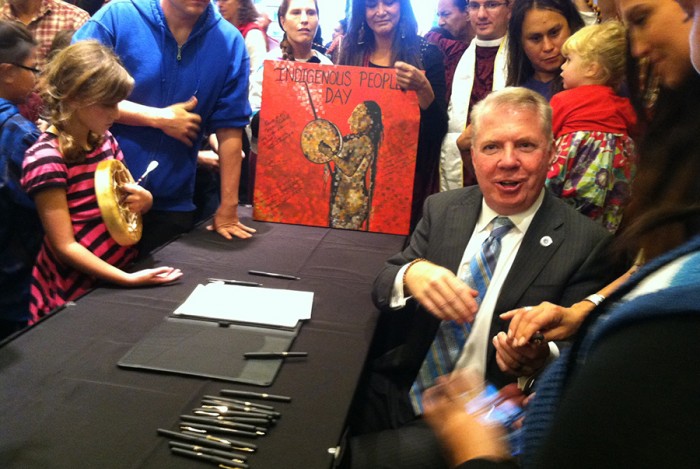 Mayor Ed Murray shakes hands with tribal leaders shortly after signing Seattle's Indigenous People's Day Resolution. (Photo by Christina Twu)