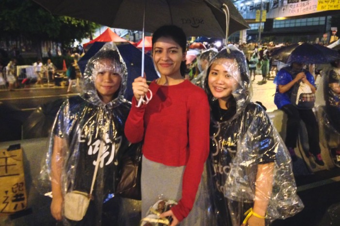 The author (left) with a Pakistani visitor who delivered homemade cake pops to rained out protesters. (Photo by Yue Ching Yeung)