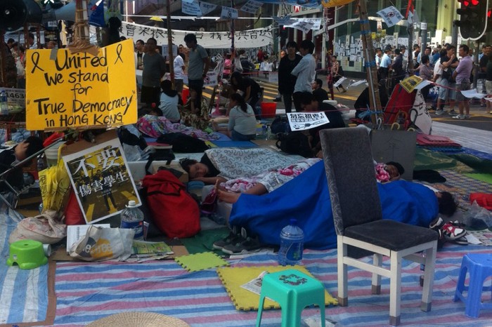 Protesters rest and sleep on Oct 11 on the road in Mong Kok, one of the occupy areas in Hong Kong. (Photo by Tammy Ho)