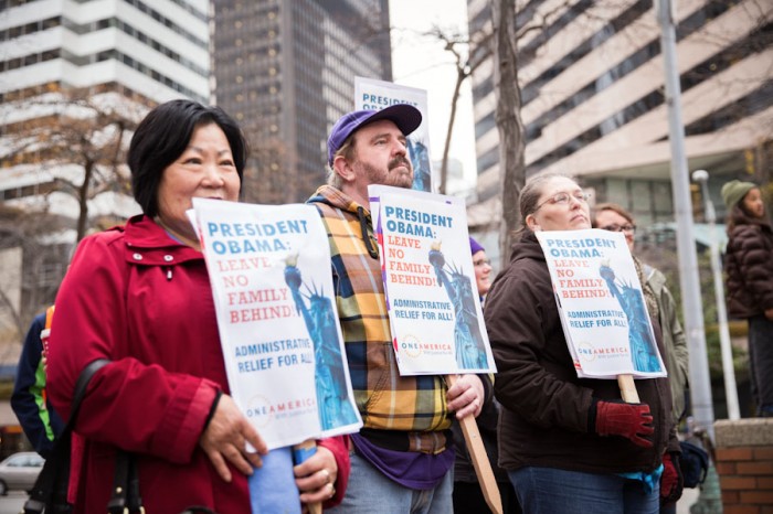 Seattleites joined Mayor Murray, Rep. Adam Smith and immigrant rights advocates at a rally outside the Federal Building Thursday, heralding Obama's executive action and demanding further steps toward immigration reform. (Photo by Alex Garland)