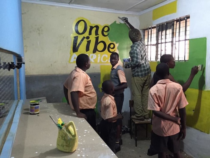 Students at the Young Generation Centre help prepare for the installation of a recording studio. (Photo courtesy of One Vibe Africa)