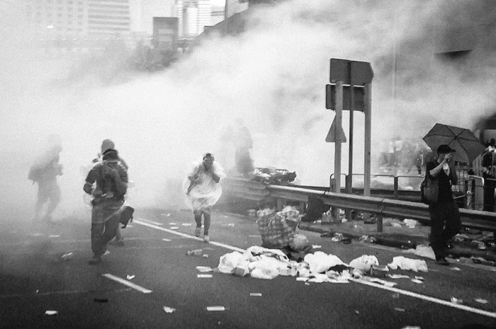 Hong Kong protesters being tear gassed at a September "Occupy Central" demonstration. (Photo by Pasu Au Yeung via Flickr Creative Commons) 