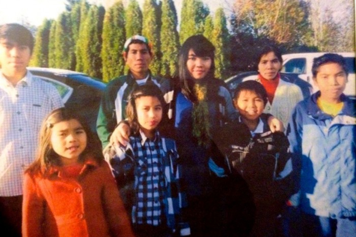 Ciin Nuam, second from left, and her family in November. Nuam, a Burmese refugee, died suddenly Dec. 2, 2014, leaving behind her husband and seven children. Courtesy Zam Khup.