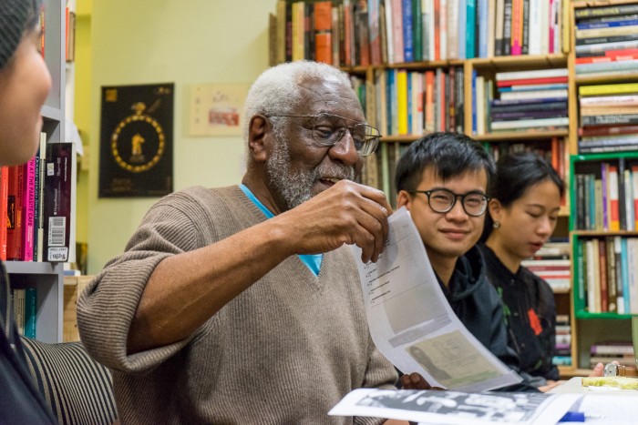 Cook speaks with activists inside a Hong Kong bookstore during one of his talks. (Photo by Chong Kai Xiong)
