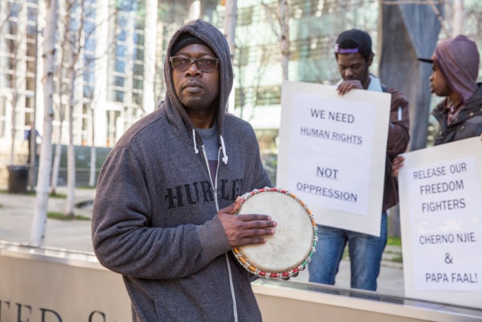 Ousman Ceesay, a Gambian American living in Seattle, turned out to show his support for two American citizens charged with trying to overthrow Gambia's dictatorship. (Photo by Alex Garland)