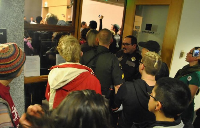 A crowd packed a King County Council meeting to object to a new youth jail. (Photo courtesy South Seattle Emerald.)