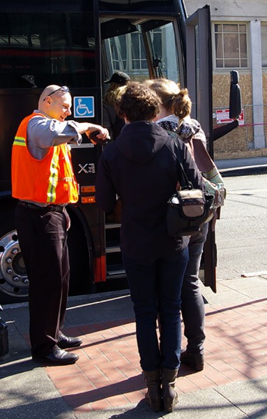 Passengers have their tickets scanned for a BoltBus to Portland outside of the International Station in Seattle (Photo by Holly Thorpe)