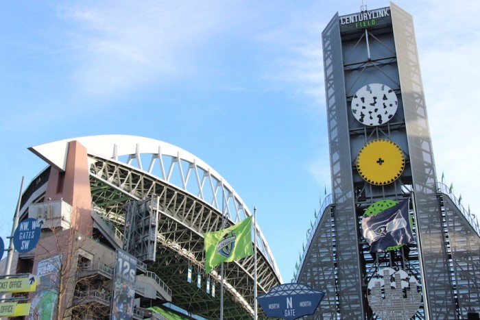 The Sounders FC flag and Seahawks flag wave on the North side of CenturyLink Field. (Photo by Justice Magraw)