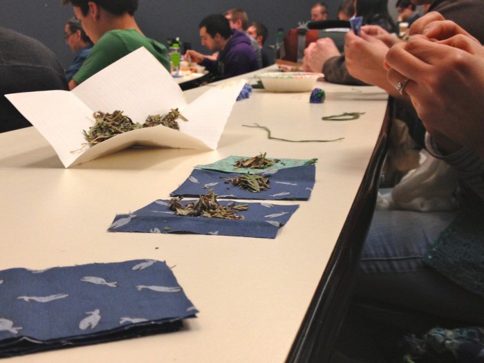 Students make gifts for UW's new Intellectual house during the lecture. (Photo by Megan Herndon)