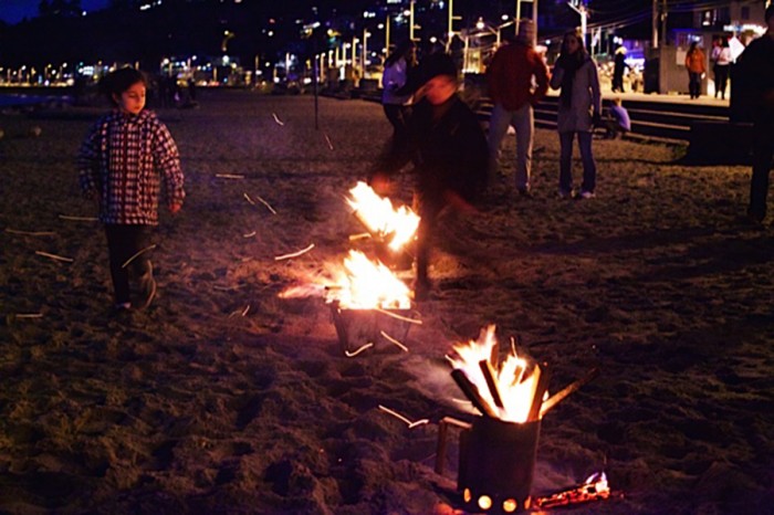 Two children play around Chaharshanbeh Suri bonfires, a Nowruz opening ceremony the author grew up with. (Photo by Lucinda Homa Gray)