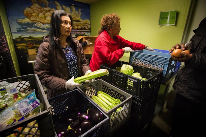 Rainier Valley Food Bank volunteers used the Japanese Kaizen philosophy to resolve food-bank “choke points.” (Ellen M. Banner/The Seattle Times)