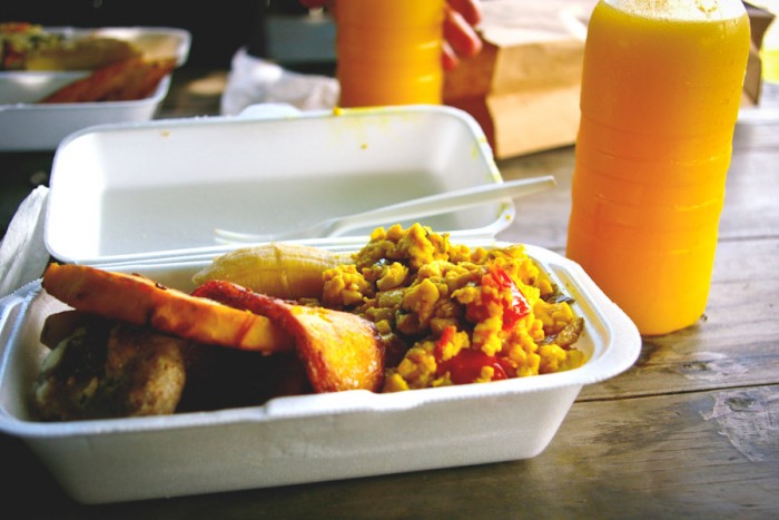 Delicious Jamaican breakfast including ackee, plantain, breadfruit, and mango-pineapple juice. (Photo from Flickr by Christina Xu)
