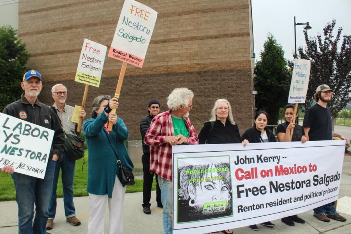 Supporters of Nestora Salgado, a Renton woman imprisoned in Mexico, hope to get Secretary of State John Kerry's attention at at appearance at Boeing last May. (Photo by Venice Buhain.)