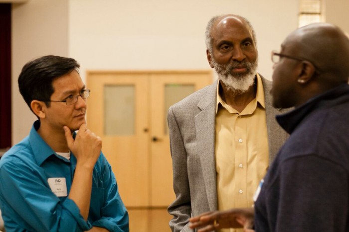 RVC Executive Director Vu Le (far left) at an RVC-sponsored community event in February featuring author john a. powell (middle) discussing how communities of color can work powerfully together. (Photo by Elisabeth Vasquez-Hein)
