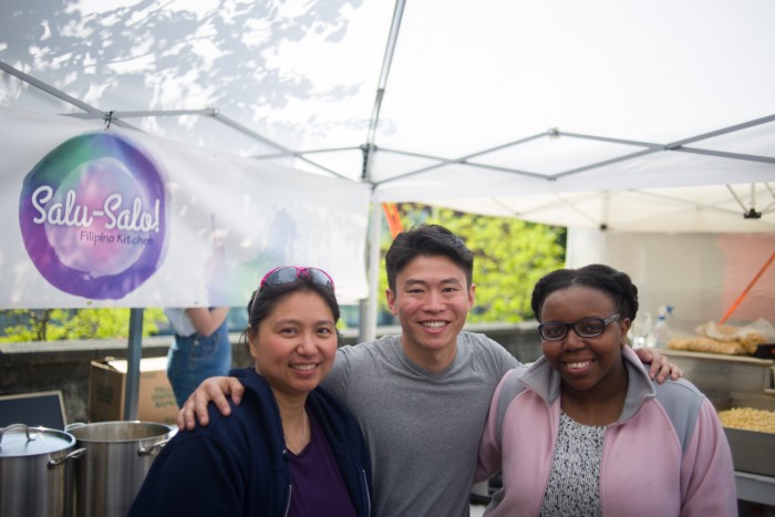 MarketShare founder Philip Deng (center) stands between the nonprofit's first fellows, Rosario Carver (left) and Jackie Nikirote (right). (Photo by Nick Wong.)