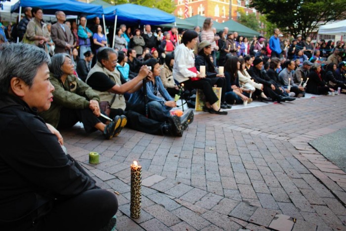 Mourners gathered for a vigil at Hing Hay park in Seattle's International District to honor slain community leader Donnie Chin. (Photo by Venice Buhain.)