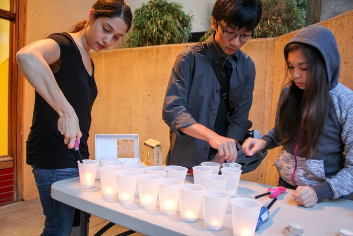 Candles are prepared for the Sunday evening vigil in honor of International District community leader Donnie Chin. (Photo by Venice Buhain.)