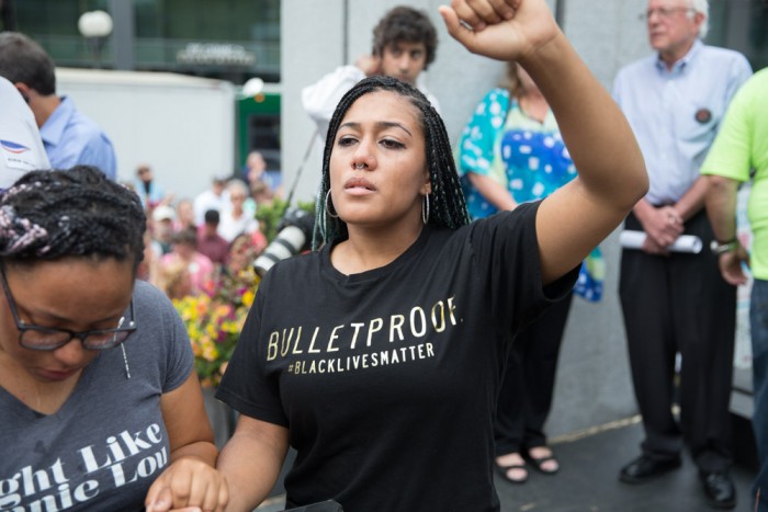 Mara Jacqueline Willaford weeps during a moment of silence for Mike Brown, killed by police last year in Ferguson, Missouri. (Photo by Alex Garland)