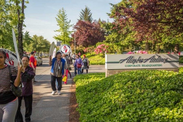 Alaska Airlines food workers demonstrate in May at the airline's corporate headquarters after the company fought the city of SeaTac's voter-approved $15 an hour minimum wage. (Photo by Alex Garland.)