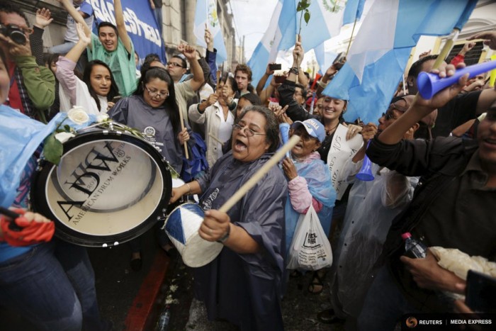 People react outside of the Guatemalan Congress building after a vote to strip President Otto Perez Molina of immunity earlier this month. (Photo from REUTERS/Jorge Dan Lopez)