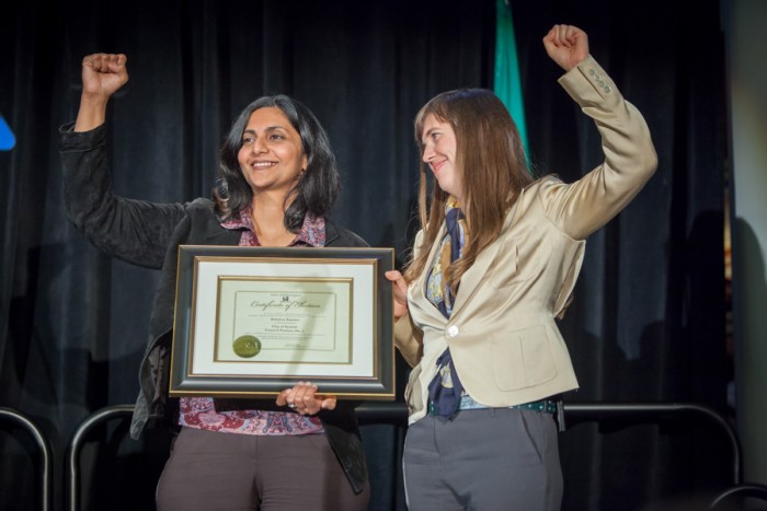 Kshama Sawant, seen here being sworn in as a City Council Member in 2014, only became a citizen and acquired voting rights in 2010 after immigrating from India years earlier. (Photo via Seattle City Council)