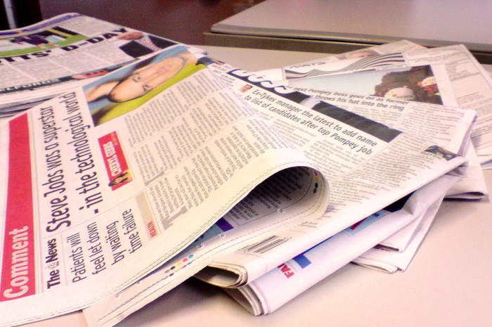 A stack of newspapers Photo by Jon S. via Flickr.