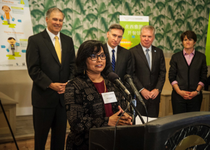 Gita Bangera speaks at the launch of Seattle's Restaurant Success Initiative meant to help aspiring restauranteurs get off on the right foot, especially those facing language barriers. (Photo courtesy Eric Stuhaug)