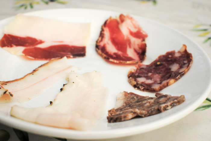 Writer Anna Goren tasted from this salumi plate sampler of cuts of pork raised and processed at Spannocchia Foundation’s organic research farm. (Photo by Anna Goren)