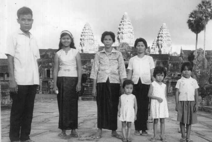 In a photo featured in The Wing's "Naga" exhibit, the So family stands at the bridge in front of Ankgor Wat, Siem Reap, Cambodia, 1967. Montha So, second from left, fled Cambodia in 1979. (Photo courtesy of Montha and Ammara Kimso) 