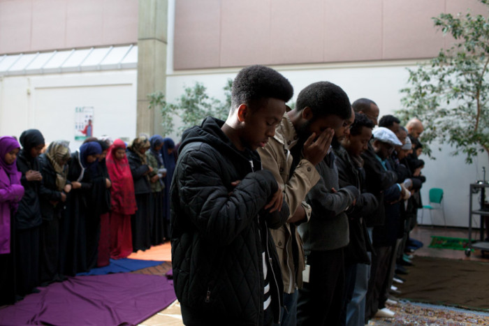 About 50 Muslim students and community members participated in a prayer for Hamza Warsame on December 9, 2015 at Seattle Central College, as more than 100 non-Muslim students and supporters circled those praying in solidarity. (Photo by Jovelle Tamayo.)