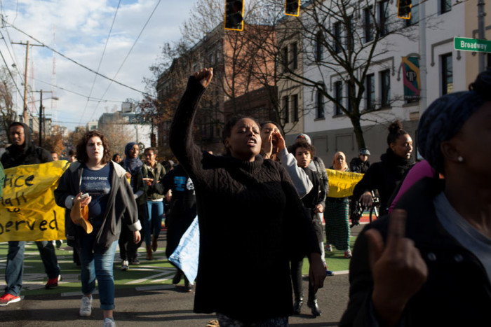 Students and community members marched from Seattle Central College to the Seattle Police Department East Precinct to protest the way the department handled the death of Hamza Warsame, who died after a fall from a Capitol Hill building. (Photo by Jovelle Tamayo.)