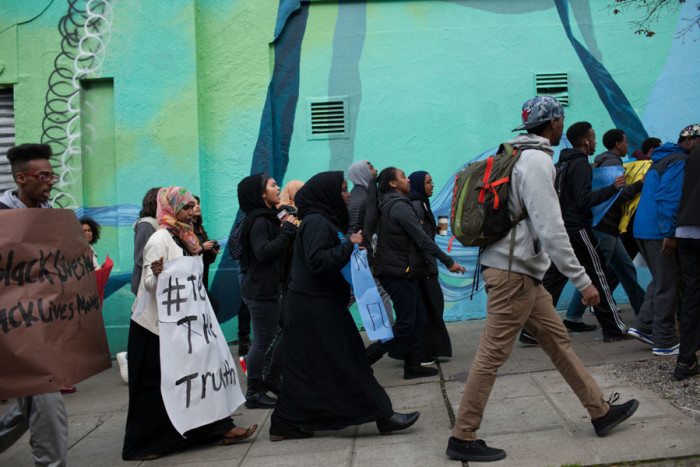 Students and community members marched from Seattle Central College to the Seattle Police Department East Precinct to protest the way the department handled the death of Hamza Warsame, who died after a fall from a Capitol Hill building. (Photo by Jovelle Tamayo.)