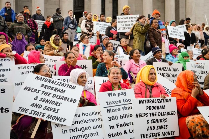 Refugees, immigrants, advocates and service providers rally on the Olympia capitol steps during the annual Refugee and Immigrant Legislative Day in 2015. (Photo by Venice Buhain.)
