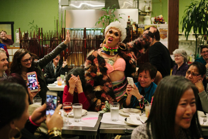 Drag queen Atasha Manila performs on Friday, January 29, 2016 at her final show at Inay’s Asian Pacific Cuisine in Beacon Hill, as Dorothy Cordova covers her face. (Photo by Jovelle Tamayo.)