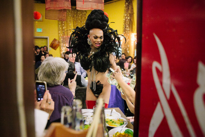 Drag queen Atasha Manila hugs a guest on Friday, January 29, 2016 at her final show at Inay’s Asian Pacific Cuisine in Beacon Hill. (Photo by Jovelle Tamayo.)