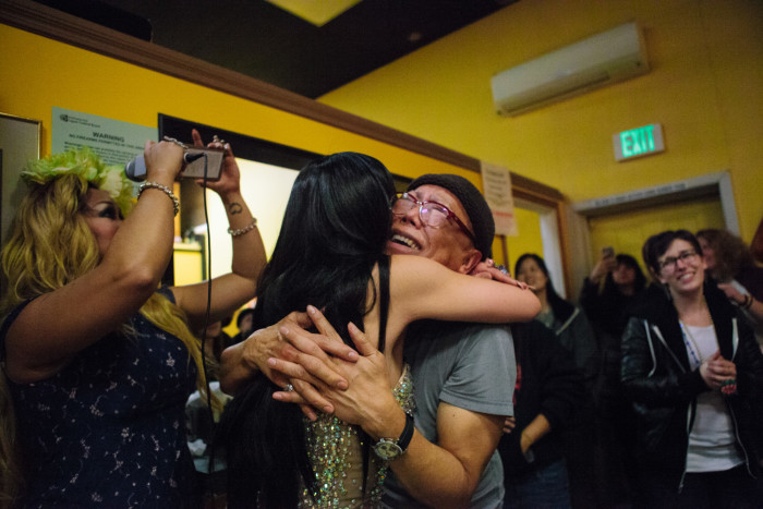 Ernie Rios, the owner of Inay’s Asian Pacific Cuisine, embraces Atasha Manila on Jan. 29, 2016 at her final Friday night drag show on the restaurant’s closing day. (Photo by Jovelle Tamayo)