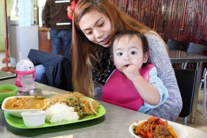 Rosa Marquez and her one-year-old daughter Rylee enjoy a lunchtime meal at Inay's. (Photo by Venice Buhain.)