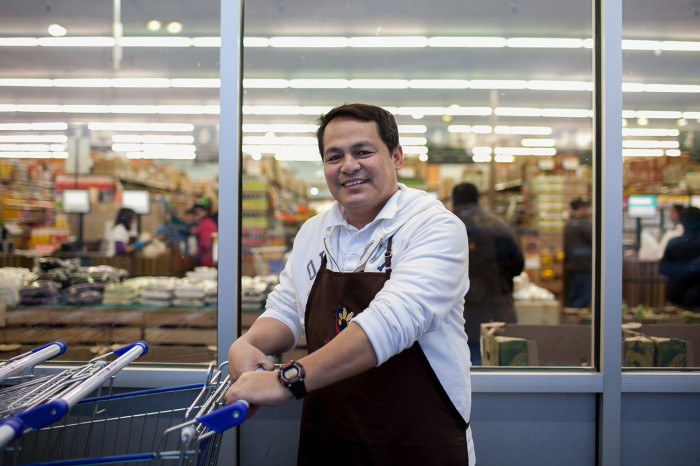 Store manager Raffy Azeron poses for a portrait outside Island Pacific Market, a Filipino-inspired grocery store in Seattle’s Rainier Valley. (Photo by Jovelle Tamayo.)