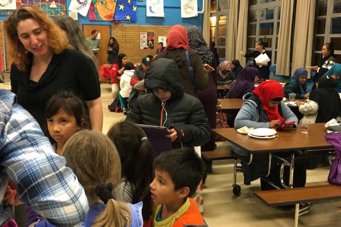 Parents gather at Graham Hill Elementary School at an event on Dec. 8. (Photo by Nimco Bulale/OneAmerica)