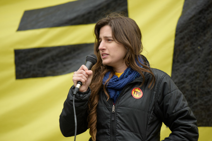 Gillian Locascio, lead organizer for the Washington State Fair Trade Coalition, speaks out against the TPP at the February 3rd rally. (Photo by Rick Berry)