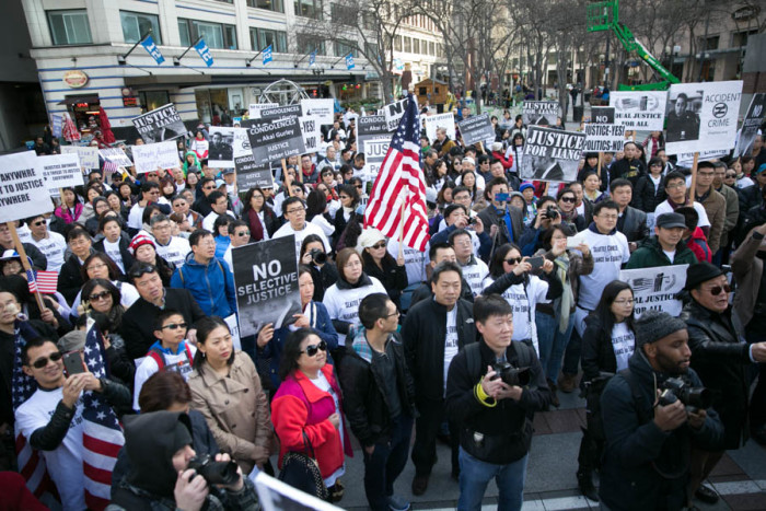 Hundreds of people gathered in Seattle to support former New York City police officer Peter Liang, who was convicted by a jury of manslaughter in the shooting death of Akai Gurley. (Photo by Alex Garland)