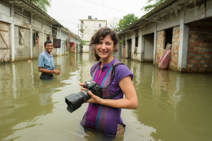 National Geographic Photographer Ami Vitale, covering flooding and the threat of rising sea levels in Bangladesh. (Courtesy photo by Michael Davie)